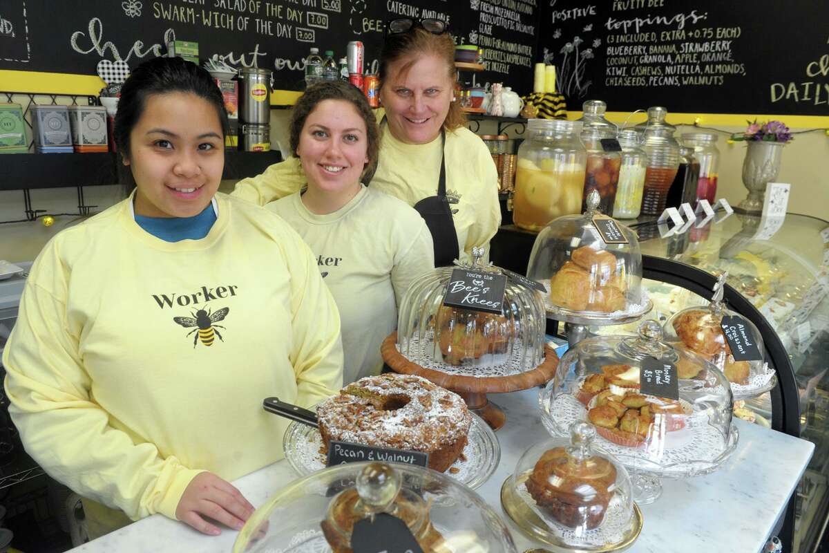 Owner Nancy Burke, right, stands with her cook Bianca ReLucio, left, and server Mily Rowland, center, at The Bee’s Knees Cafr in the Walnut Beach neighborhood of Milford.
