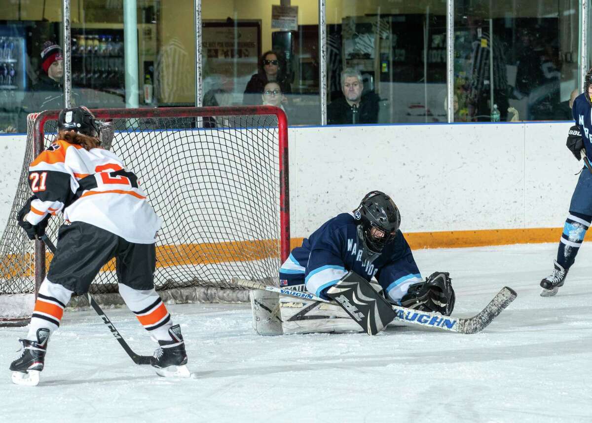 Goalie Erin McMorris makes a save during Wilton's 3-2 win over Ridgefield on Friday.