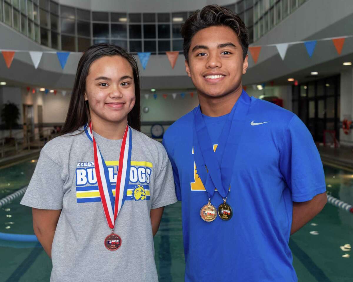 Kelly Catholic swimmers, sister and brother Kelsy and Keith Elgar stand for a portrait before jumping in the pool for practice at the Christus Health and Wellness Center on January 23, 2020. Fran Ruchalski/The Enterprise