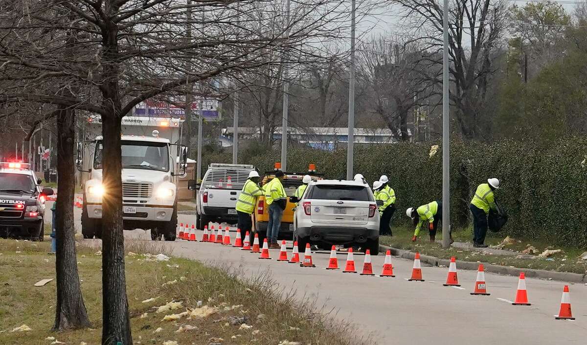 Workers are shown along Gessner Rd. Saturday, January 25, 2020 in Houston near Watson Grinding and Manufacturing, 4525 Gessner Rd., where an explosion occurred on Friday. The streets around the site are still closed.