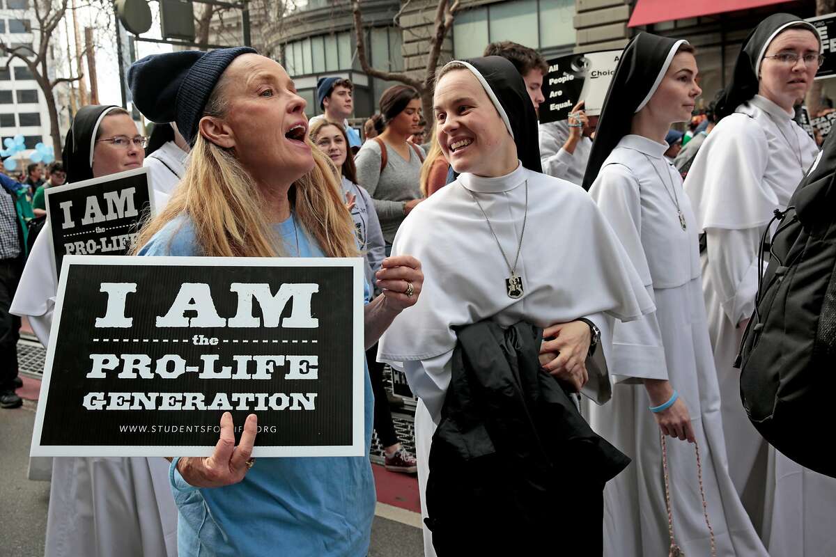 From left: Mary Cresalia and Sister Maria Karol chat during the March for Life demonstration, Saturday, Jan. 25, 2020, in San Francisco, Calif. Demonstrators marched along Market Street from the Civic Center Plaza to protest abortion.