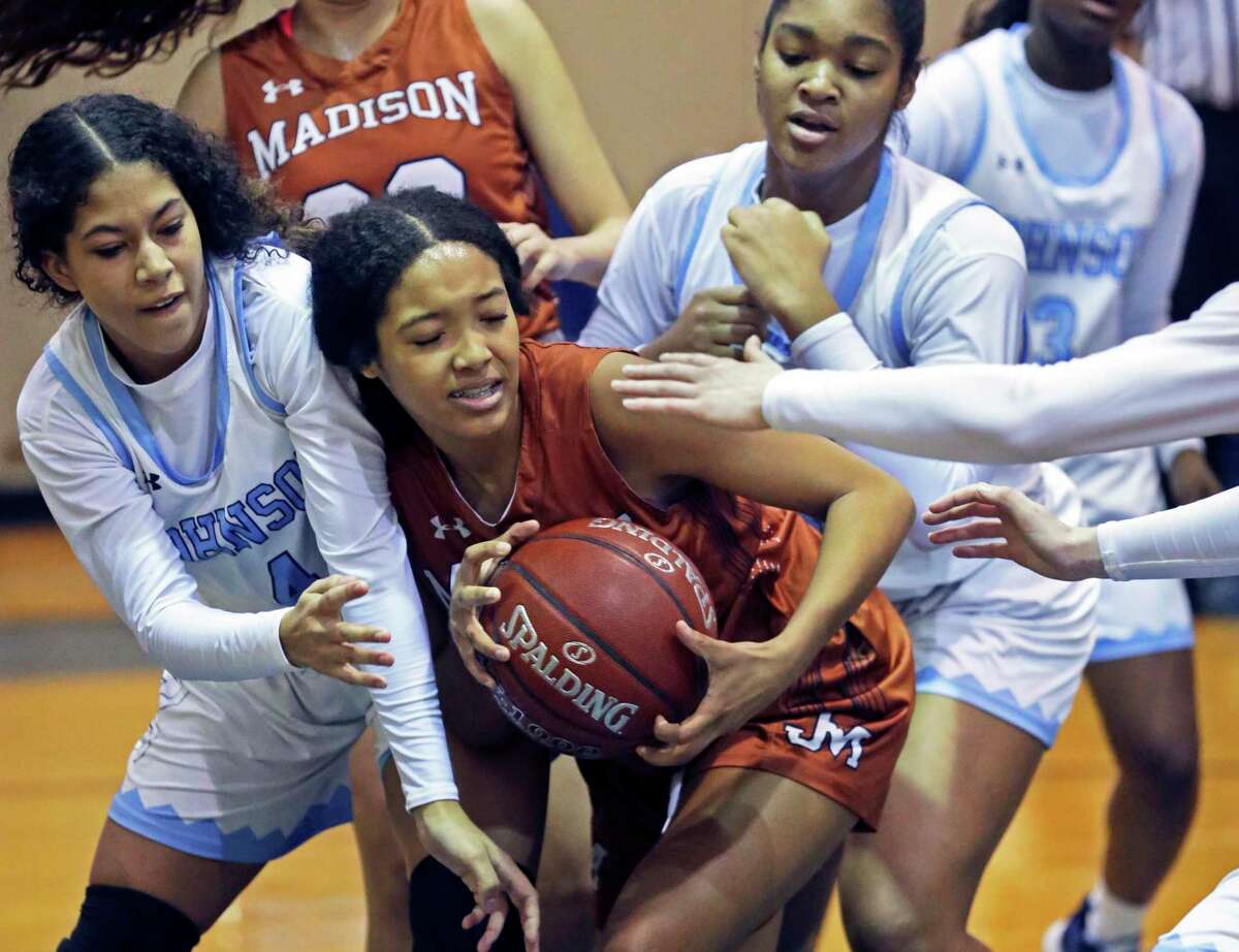 Lady Mav forward Dallasstar Johnson is pressure after a rebound by a crowd of defenders as Johnson hosts Madison in girls basketball at Johnson High School on Jan. 25, 2020.