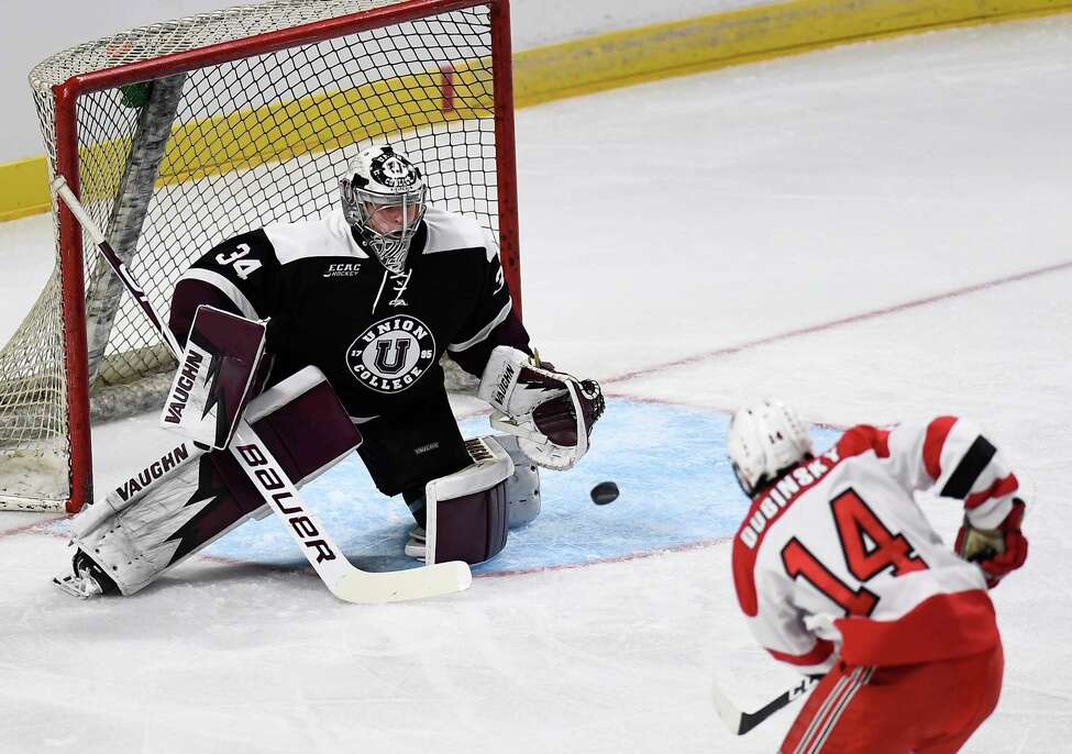 Union goaltender Darion Hanson (34) makes a save against Rensselaer Polytechnic Institute forward Zach Dubinsky (14) during the first period of the men's Mayor's Cup college hockey game Saturday, Jan. 25, 2020, in Albany, N.Y. (Hans Pennink / Special to the Times Union) ORG XMIT: 012620_Men_HP136