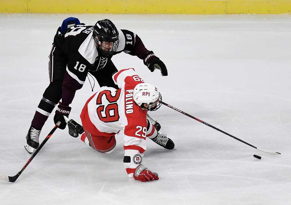 Union forward Brett Supinski (18) and Rensselaer Polytechnic Institute forward Patrick Polino (29) chase the puck during the first period of the men's Mayor's Cup college hockey game Saturday, Jan. 25, 2020, in Albany, N.Y. (Hans Pennink / Special to the Times Union) ORG XMIT: 012620_Men_HP137