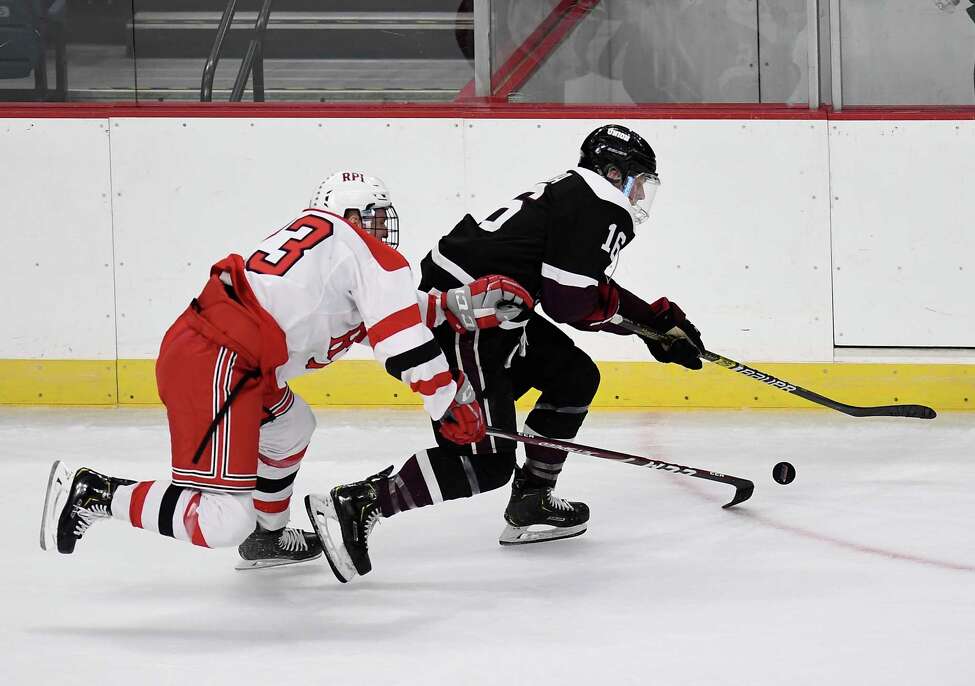 Rensselaer Polytechnic Institute defenseman Jake Johnson (23) and Union forward Christian Sanda (16) chase the puck during the first period of the men's Mayor's Cup college hockey game Saturday, Jan. 25, 2020, in Albany, N.Y. (Hans Pennink / Special to the Times Union) ORG XMIT: 012620_Men_HP139