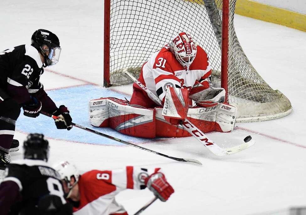 Rensselaer Polytechnic Institute goaltender Owen Savory (31) deflects a shot by Union forward Parker Foo (22) during the first period of the men's Mayor's Cup college hockey game Saturday, Jan. 25, 2020, in Albany, N.Y. (Hans Pennink / Special to the Times Union) ORG XMIT: 012620_Men_HP140