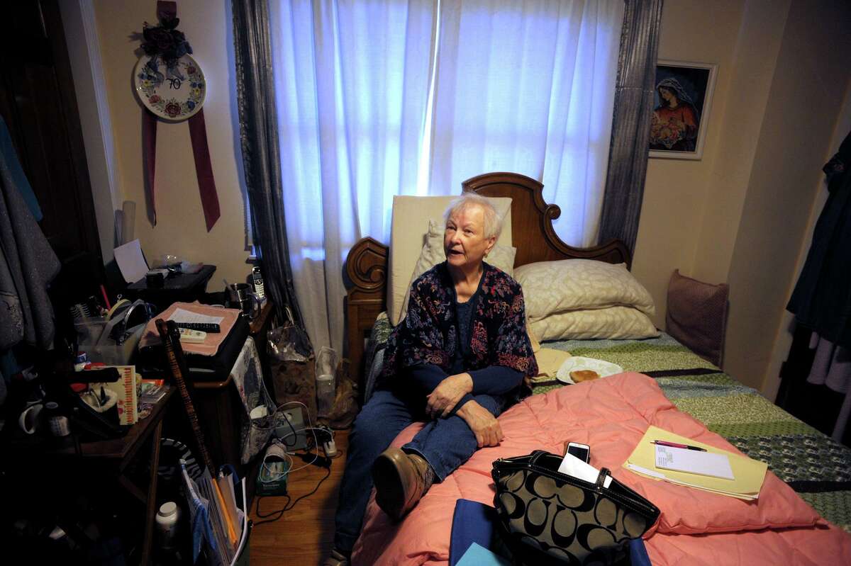 Maria Michaels speaks during an interview in the bedroom where she spends most of her time in her home in Stratford, Conn. Jan. 17, 2020. Michaels, 87, is appealing a recent eviction order to vacate the home where she has lived for over 50-years.