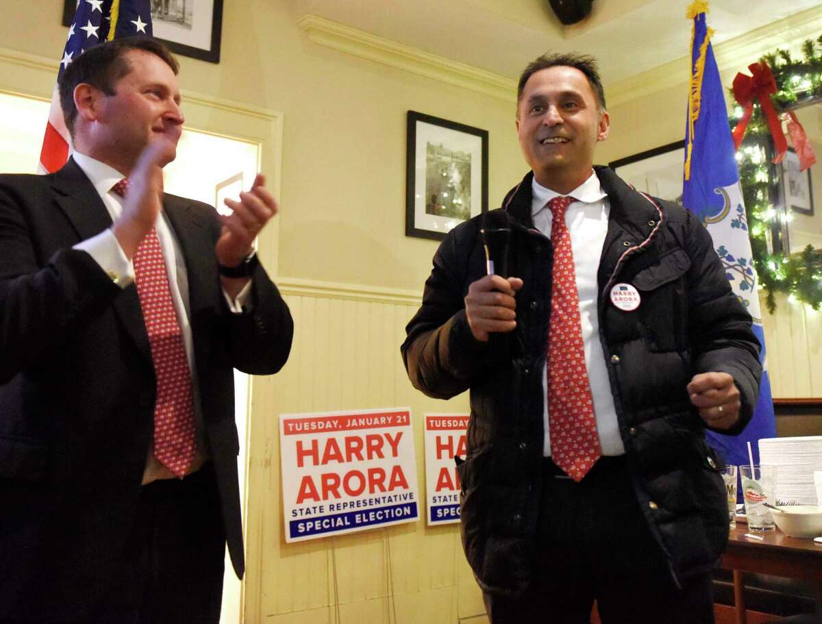 Republican Harry Arora, right, with Greenwich RTC Chair Richard DiPreta, thanks his supporters after it was announced that Arora had won the special election at Caren's Cos Cobber in the Cos Cob section of Greenwich, Conn. Tuesday, Jan. 21, 2020. Arora beat Democratic candidate Cheryl Moss to take over First Selectman Fred Camillo's former seat as a representative in the state's 15st House District.