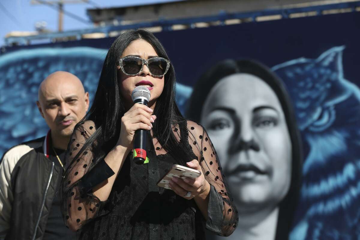 Jacqueline Becerra, a local nursing director, pastor and philanthropist, speaks as her portrait in a mural is unveiled on the side of Botello Food Store in the cityâs Westside, Sunday, Jan. 26, 2020. The with a mural is located in the underserved area of San Antonio where Becerra grew up. The mural â?“ painted by local street art duo, Los Otros â?“ is intended to inspire others in similar circumstances to reach their full potential. It was commissioned as part of Western Governors University's national "Role Model Murals" project. On the left is her husband Pastor Henry Becerra.