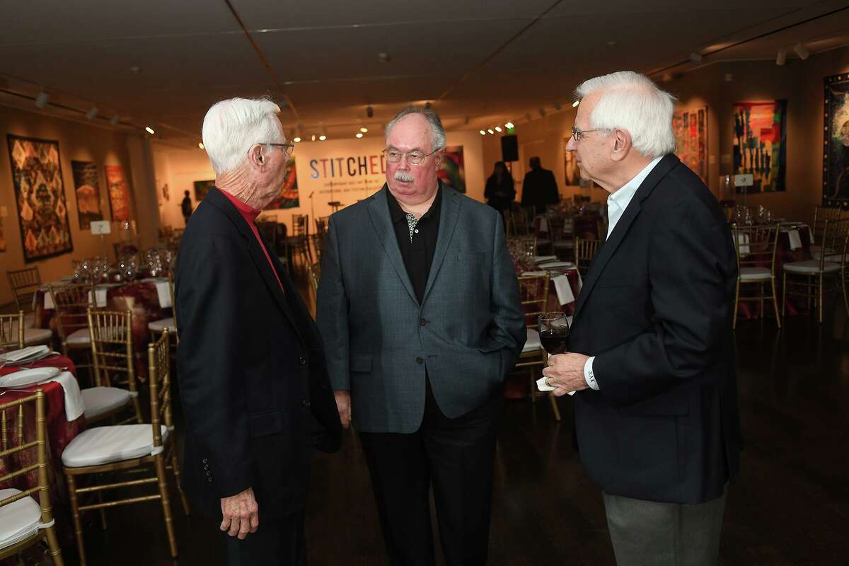 John McClain, center, chats with Pearl Fincher Museum board members Charles Dunagan, left, and Tom Kikis during the Pearl Fincher Sports Night at the museum on Jan. 25, 2020.
