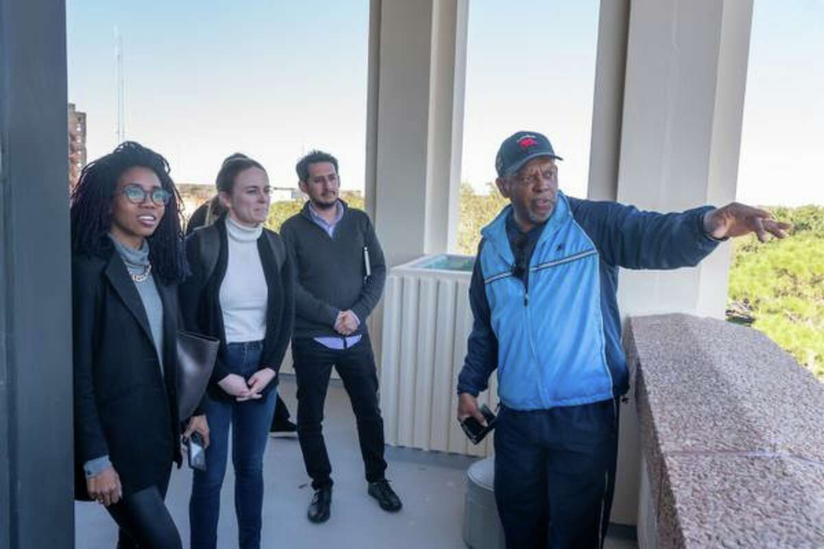 John Beard, executive director of Port Arthur Community Action Network, right, gives students, Erick Diaz, Stephanie Thomas, and Brooke Wages a bird's eye tour of the city from the observation deck at city hall. Harvard students from the Center for Public Leadership visited Port Arthur to gain insight from city leaders and the community regarding their issues, and also how communities of color can be assisted in addressing those challenges. Photo made on January 24, 2020. Fran Ruchalski/The Enterprise