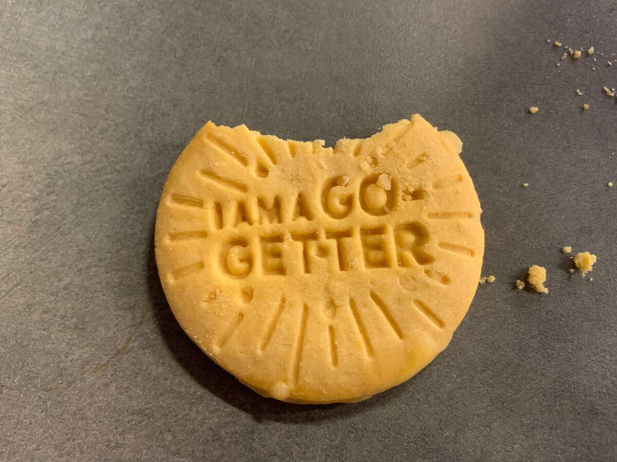 One of the new Lemon-Ups flavor Girl Scout Cookies (with one bite removed).