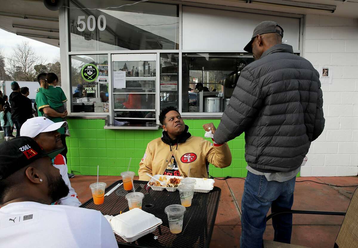 (From left to right) Bay Area rappers Vai Webb, Lo Griff, Rich Rocka, and DJ Toure hang out at Vegan Mob, located at 500 Lake Park Ave., in Oakland, Calif., on Saturday, January 25, 2020.
