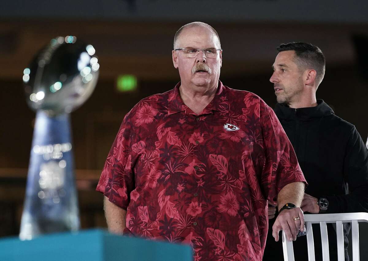 Kansas City Chiefs' coach Andy Reid, left, stands next to San Francisco 49ers coach Kyle Shanahan during Opening Night for the NFL Super Bowl 54 football game Monday, Jan. 27, 2020, at Marlins Park in Miami. (AP Photo/David J. Phillip)