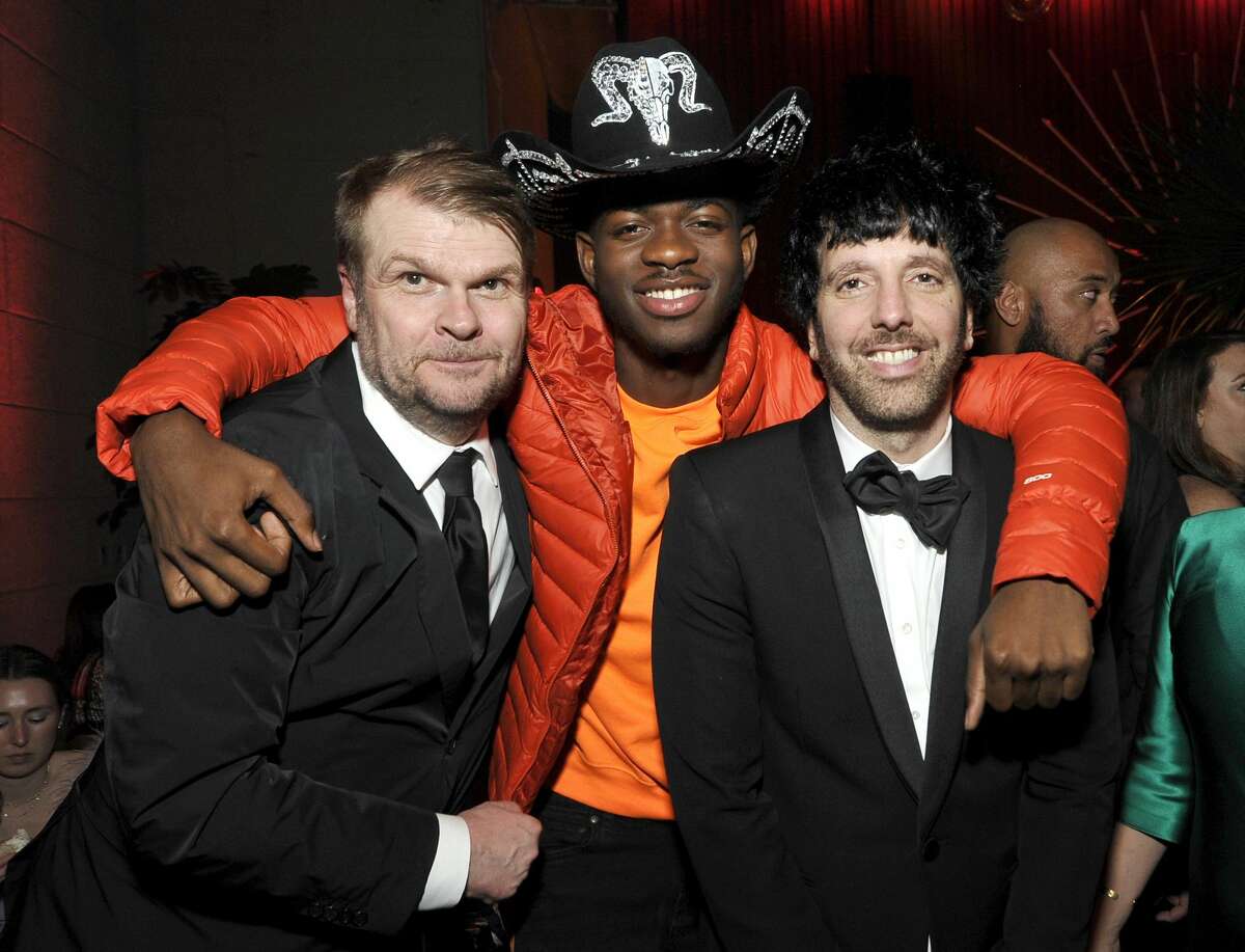 LOS ANGELES, CALIFORNIA - JANUARY 26: (L-R) Sony Music Group Chairman Rob Stringer, Lil Nas X, and Columbia Chairman & CEO Ron Perry attend the Sony Music Entertainment 2020 Post-Grammy Reception at NeueHouse Hollywood on January 26, 2020 in Los Angeles, California. (Photo by John Sciulli/Getty Images for Sony)