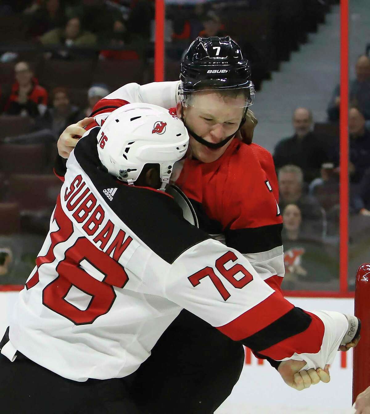 Ottawa Senators left wing Brady Tkachuk (7) fights New Jersey Devils defenseman P.K. Subban (76) during second period NHL hockey action in Ottawa on Monday, Jan. 27, 2020. (Fred Chartrand/The Canadian Press via AP)
