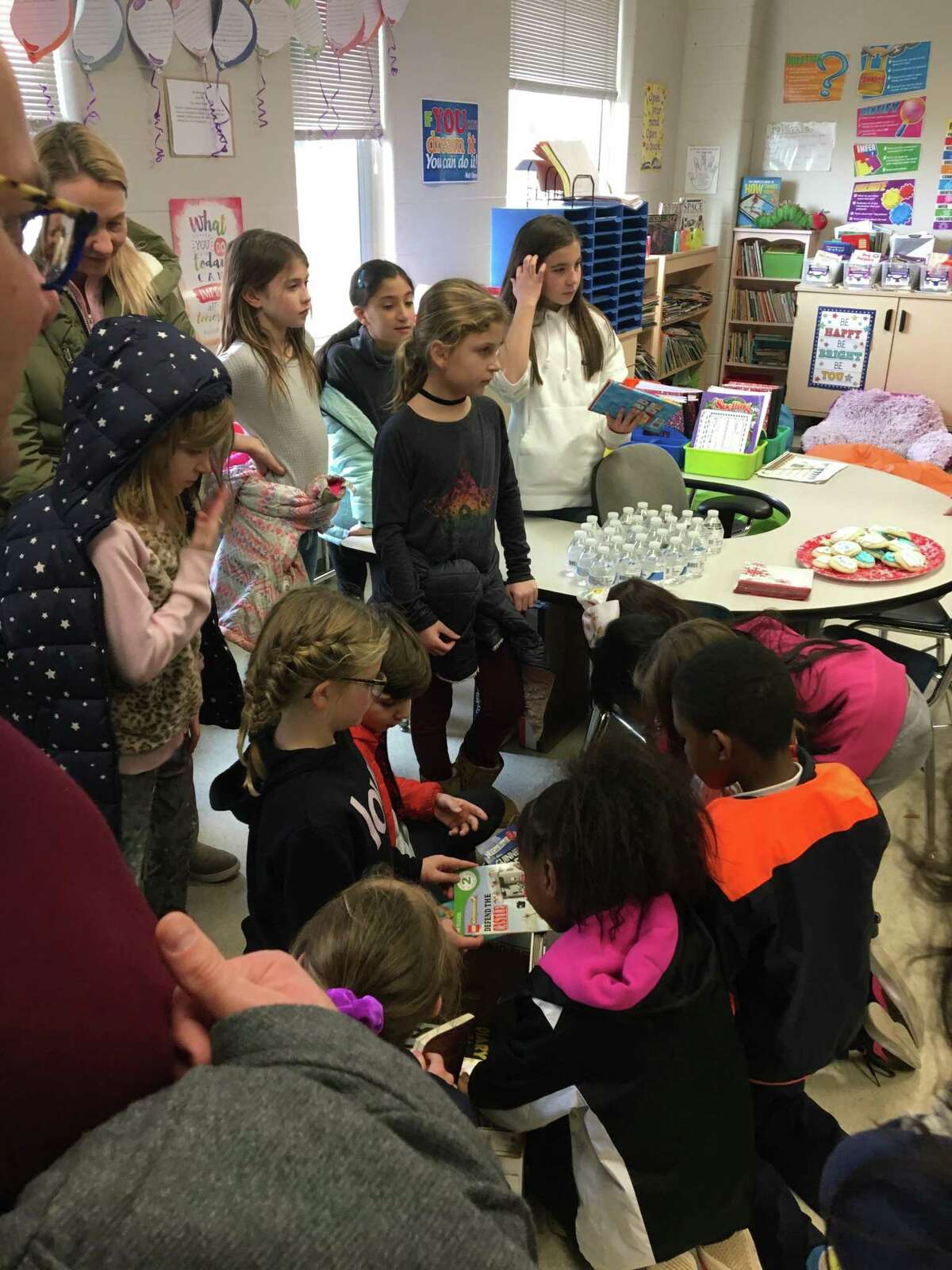 South School students, families and staff in New Canaan recently came together and packed more than 700 meal bags for the Filling In The Blanks warehouse. The students also supported a Holiday Book Drive for Geraldine W. Johnson School in Bridgeport.