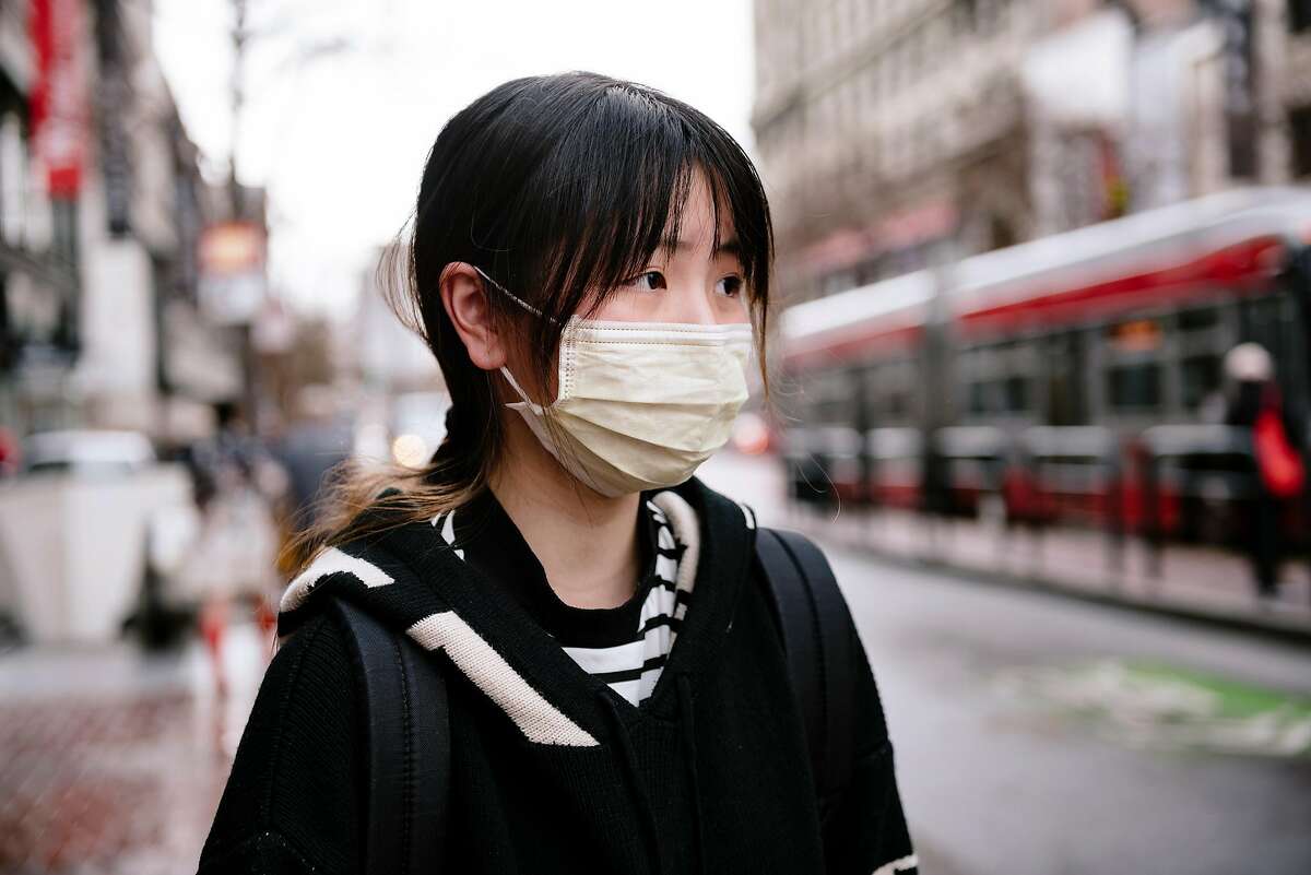 City college student Ziemi Chen wears a filter mask because of fears over the coronavirus outbreak, in San Francisco, Calif, on Tuesday, January 28, 2020.