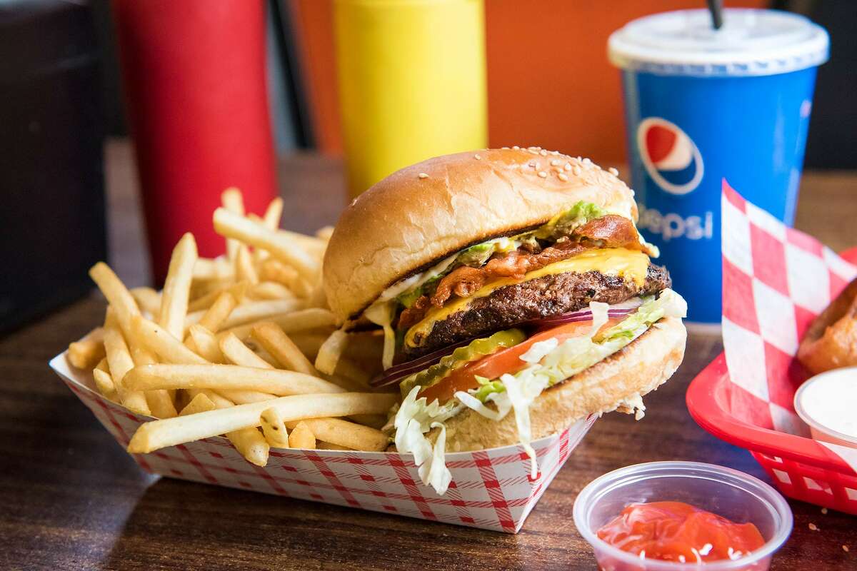 The menu at Char-Pit consists of the Charburger, available in quarter- or half-pound sizes, alongside fried favorites like onion rings and french fries. It also has burgers that come with specialized toppings.