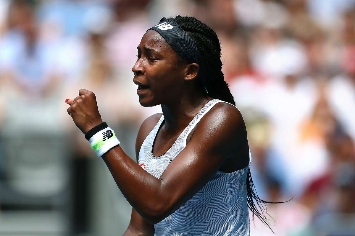 MELBOURNE, AUSTRALIA - JANUARY 26: Coco Gauff of the United States celebrates during her Women's Singles fourth round match against Sofia Kenin of the United States on day seven of the 2020 Australian Open at Melbourne Park on January 26, 2020 in Melbourne, Australia. (Photo by Kelly Defina/Getty Images)