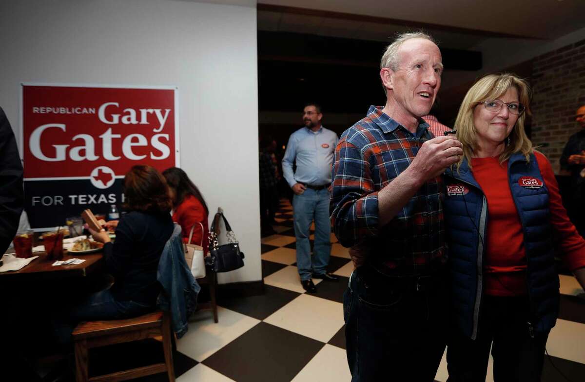 Republican Gary Gates hugs his wife, Melissa at his election night watch party for the House District 28 special election at Gallery Furniture, Tuesday, Jan. 28, 2020, in Richmond.
