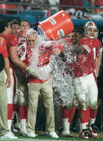 San Francisco 49ers wide receiver Jerry Rice, right, celebrates a first  half touchdown with cornerback Deion Sanders, center, as quarterback Steve  Young (8) looks on at the Georgia Dome in Atlanta on