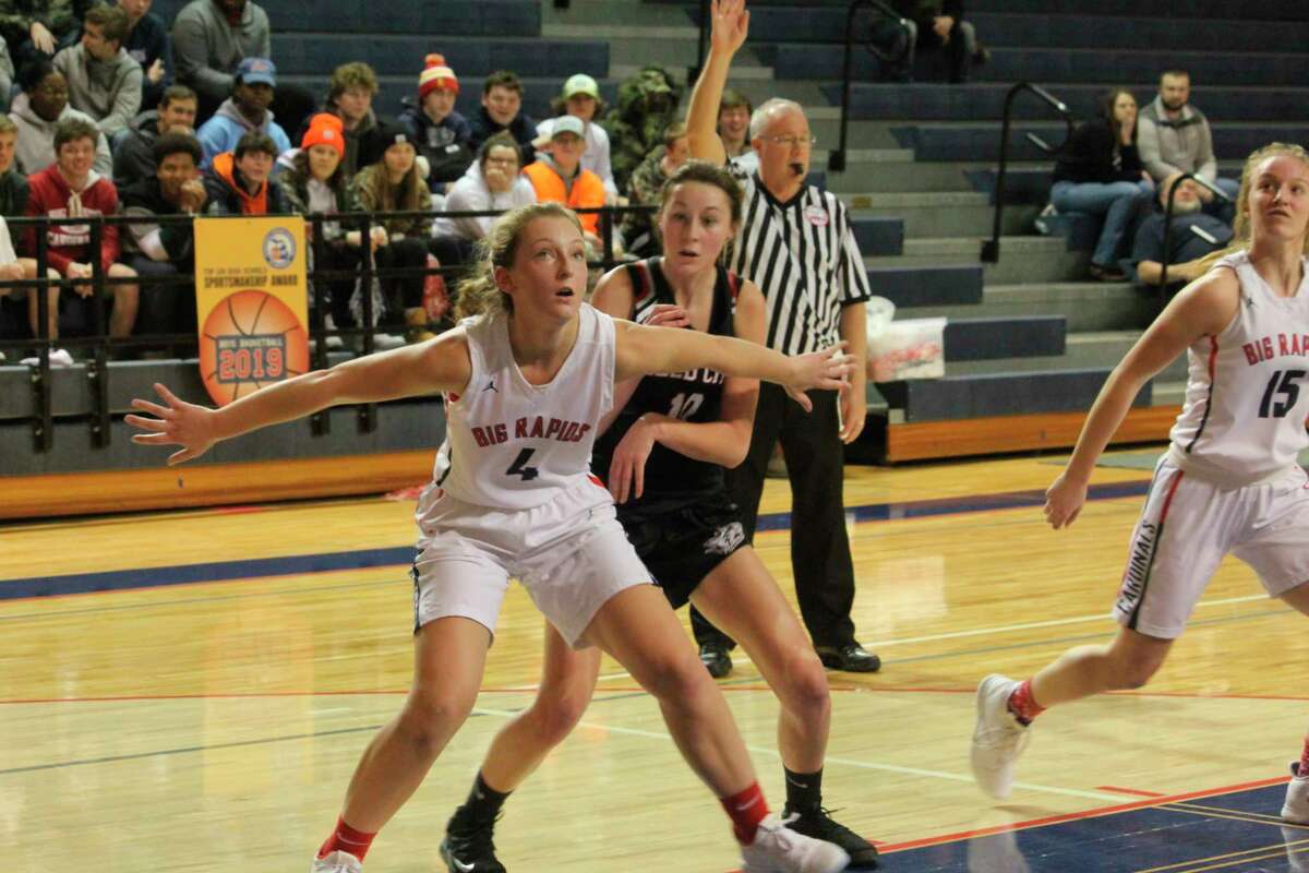 Reed City's Mackenzie Vandawater (10) battles Big Rapids' Holly Mckenna for positioning in recent action. (Herald Review/John Raffel)