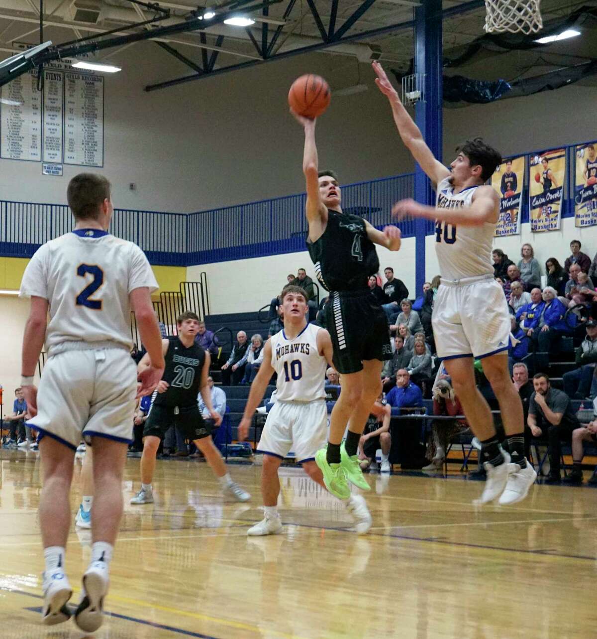Pine River's Jayce Methner goes for a layup, while Carter Veldkamp of Morley Stanwood tries to block the attempt during Monday night's game at MSHS. (Herald Review photo/Joe Judd)