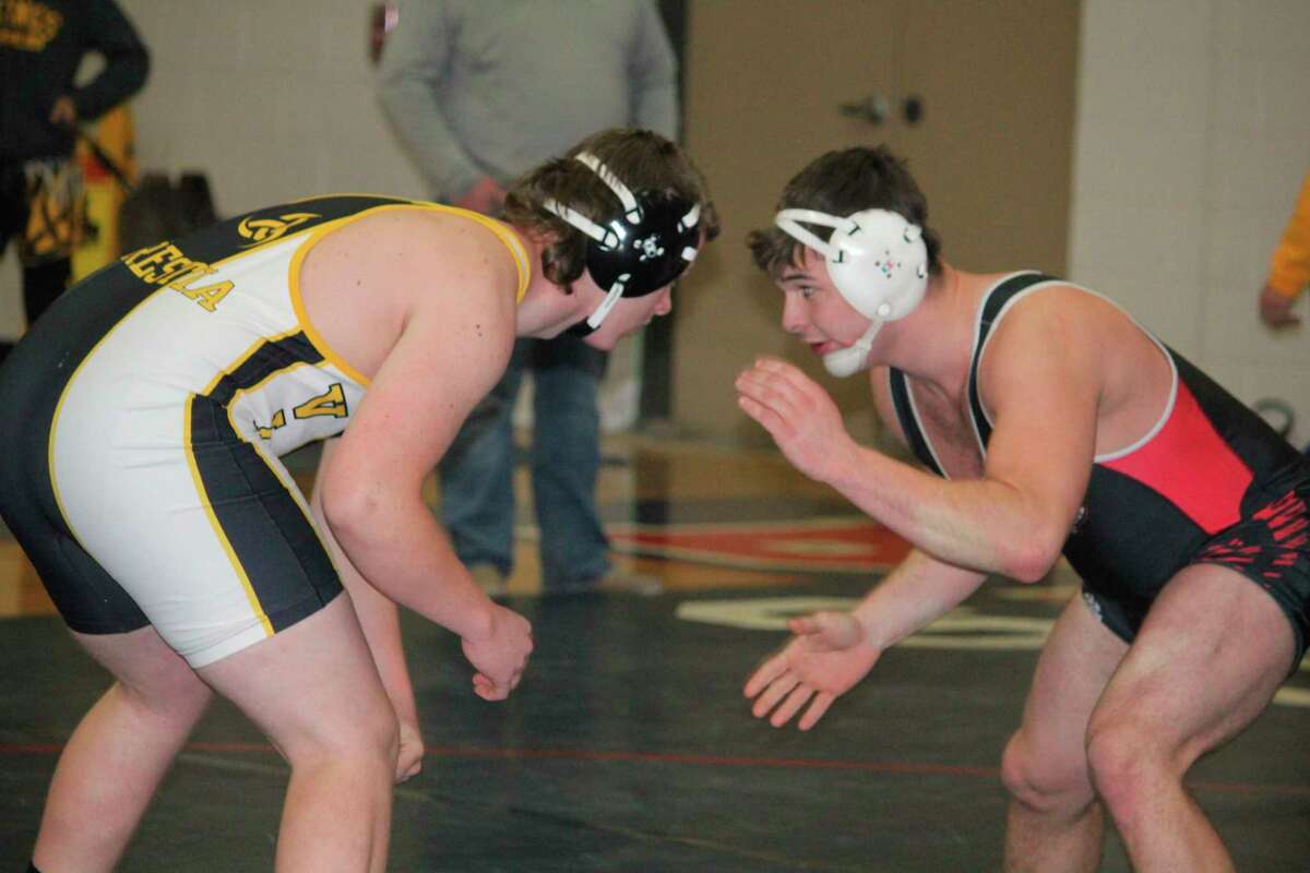 Reed City's Austin Fowler battles an opponent from Tri County at Big Rapids on Jan. 22. (Herald Review photo/John Raffel)