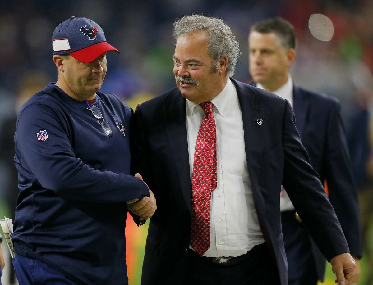 Head coach Bill O'Brien of the Houston Texans shakes hands with Houston Texans executive Cal McNair as they leave the field after defeating the Miami Dolphins at NRG Stadium on October 25, 2018 in Houston, Texas.