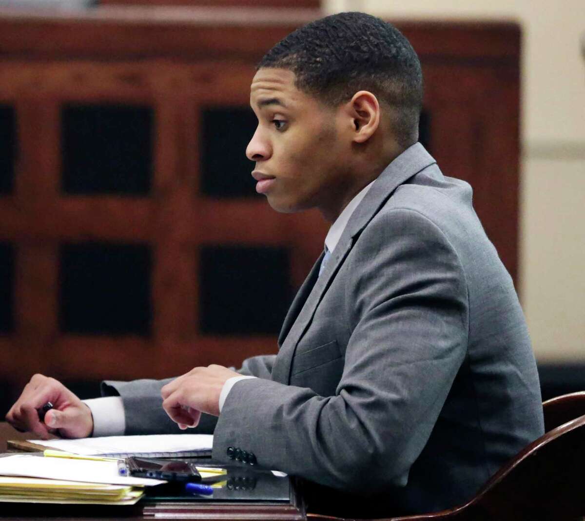 Anton Harris goes over notes before closing statements by attorneys in his sexual assault trial Wednesday, Jan. 29, 2020.