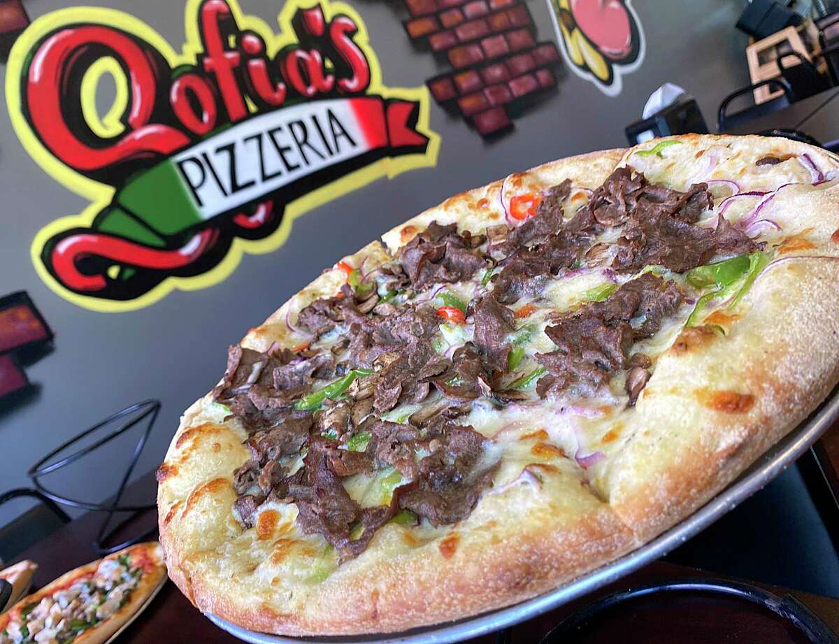 The Philly cheesesteak pizza includes shaved sirloin, onions, bell peppers, mushrooms, mozzarella cheese and creamy white sauce at Sofia's Pizzeria.