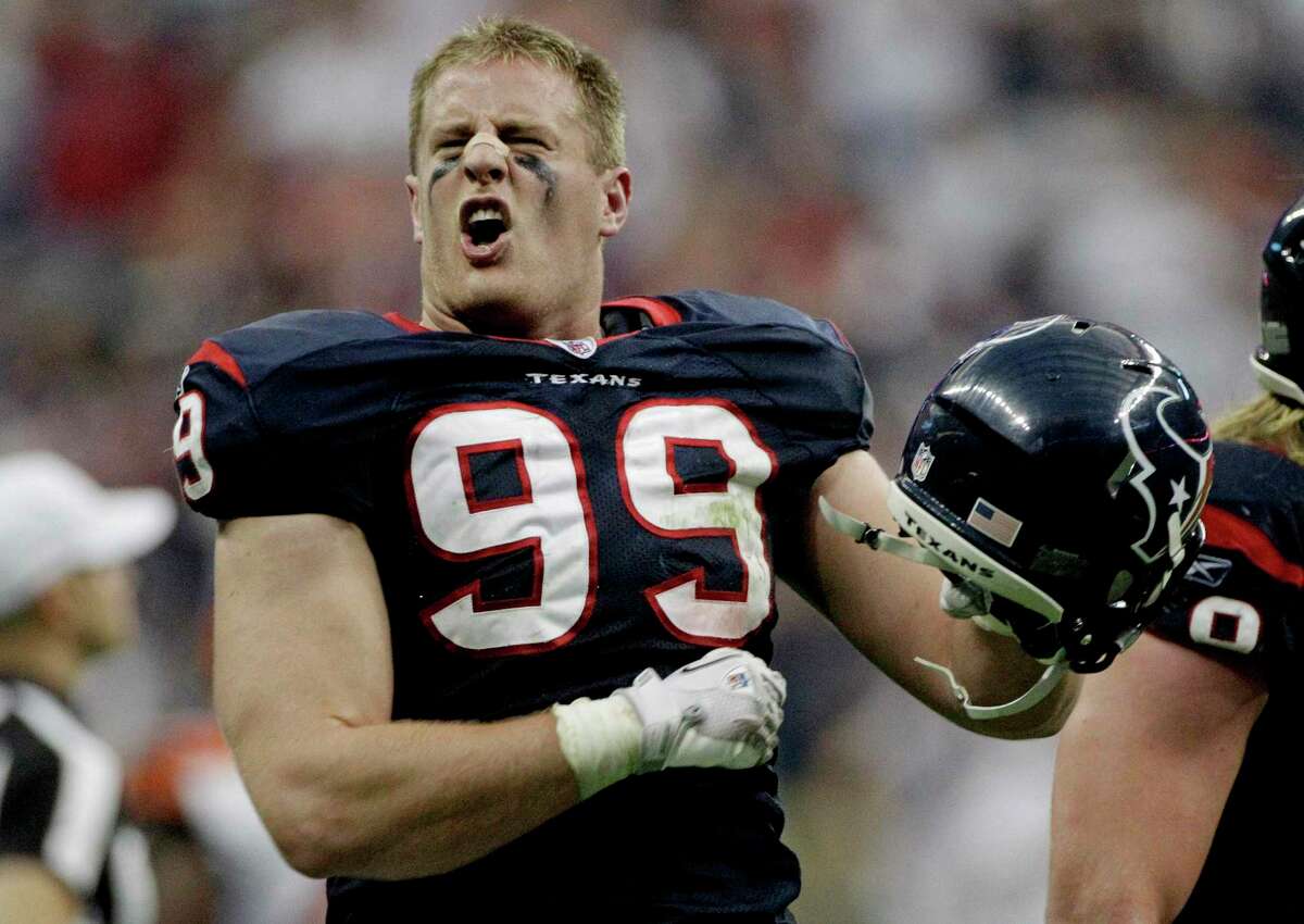 FILE - In this Jan. 7, 2012, file photo, Houston Texans defensive end J.J. Watt celebrates returning an interception for a touchdown against Cincinnati Bengals quarterback Andy Dalton during the second quarter of an NFL wild-card playoff football game in Houston.Reaching the playoffs for the last two seasons has made the Houston Texans hungry to do much more in 2013. (AP Photo/Tony Gutierrez, File)