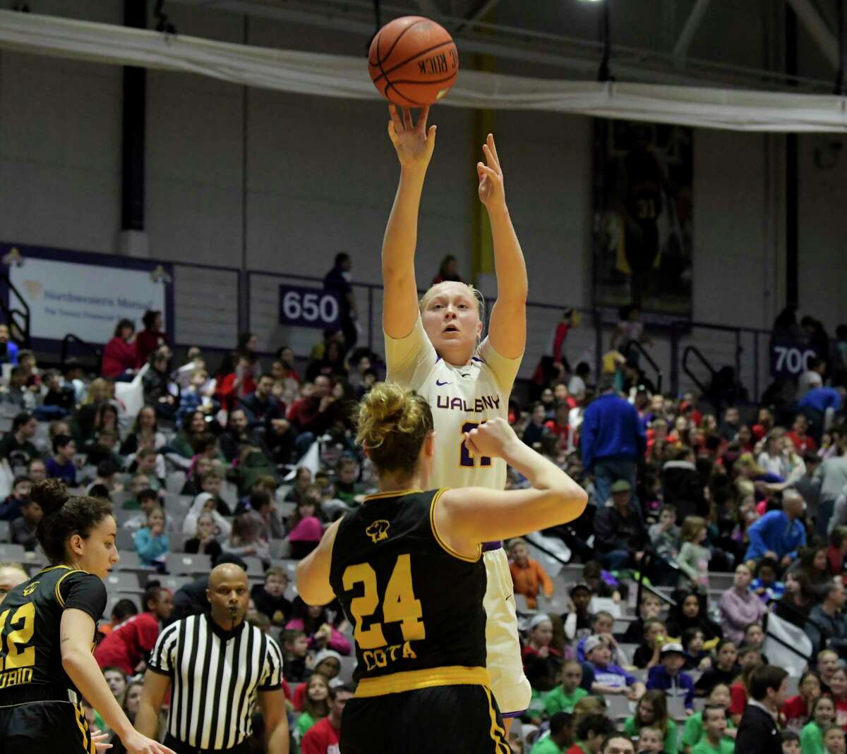 UAlbany's Helene Haegerstrand puts up a shot over a UMBC player in a 2020 matchup. Haegerstrand, who's from Stockholm, said coming to the U.S. for college allowed her to balance basketball and school in a way she couldn't in Sweden.