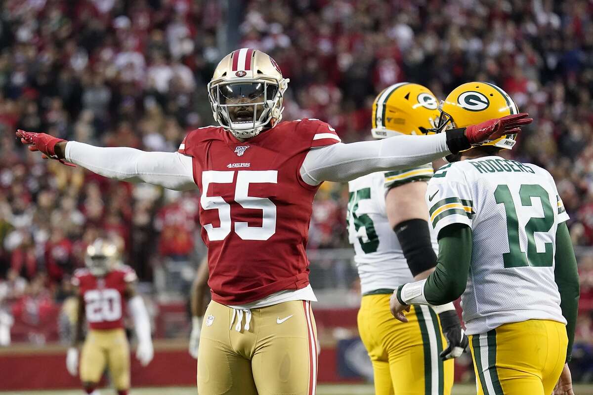 San Francisco 49ers defensive end Dee Ford (55) gestures next to Green Bay Packers quarterback Aaron Rodgers (12) during the first half of the NFL NFC Championship football game Sunday, Jan. 19, 2020, in Santa Clara, Calif. (AP Photo/Tony Avelar)