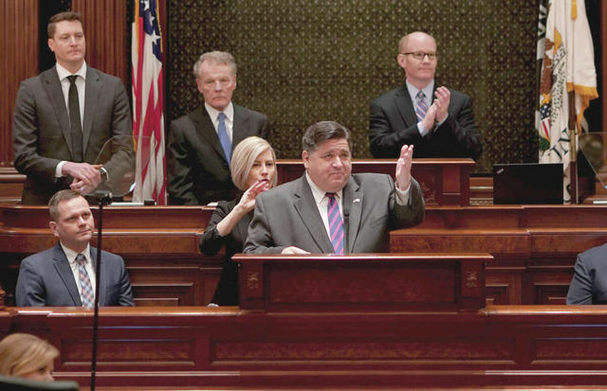 Gov. J.B. Pritzker delivers his first State of the State speech before a joint session of the Illinois House and Senate at the Capitol on Wednesday. Behind Pritzker is House Speaker Michael Madigan (left) and new Senate President Don Harmon.