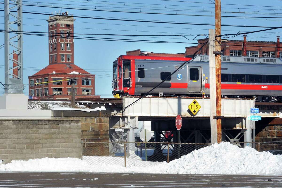 A Metro-North train passes through Bridgeport, Conn. Jan. 5, 2018, near the site of the proposed train station for the city’s East Side.