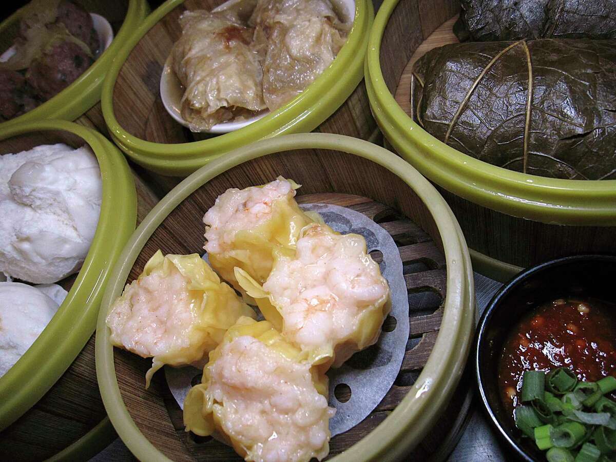 Dim sum options include shrimp shumai dumplings, char siu pork bao, meatballs, sin jok rolls in tofu skin and nor mai gai wrapped in lotus leaves at Golden Wok.