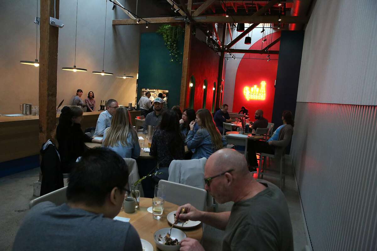 Customers are seen at tables at Fort Point Taproom on Friday, January 24, 2020 in San Francisco, Calif.