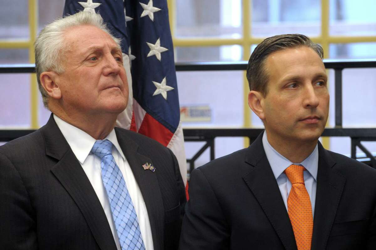 Mayor Harry Rilling, left, and State Sen. Bob Duff attend a news conference at the South Norwalk train station, in Norwalk, Conn. Jan. 6, 2020.