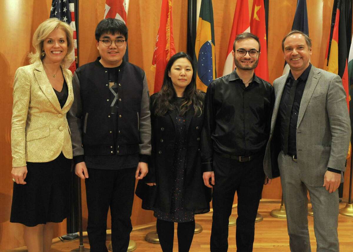 Judges Olga Kern (left) and Sebastian Lang-Lessing flank the three finalists in the Gurwitz International Piano Competition: Jiale Li (from left), Yedam Kim and Leonardo Colafelice.