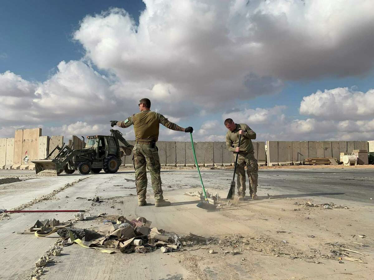 A file picture taken on Jan. 13, 2020 during a press tour organized by the U.S.-led coalition fighting the remnants of the Islamic State group, shows U.S. soldiers clearing rubble at Ain al-Asad military airbase in the western Iraqi province of Anbar. Nearly three dozen US troops suffered traumatic brain injuries or concussion in the recent Iranian air strike on a military base in Iraq housing American personnel, the Pentagon said on Jan. 24, 2020. “Thirty-four total members have been diagonosed with concussions and TBI (traumatic brain injury),” Pentagon spokesman Jonathan Hoffman told reporters.