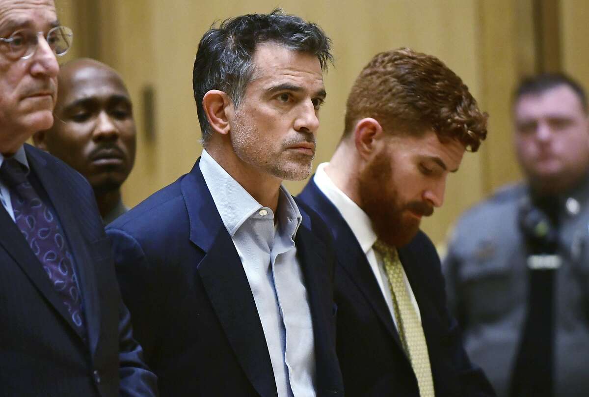 Fotis Dulos, the estranged husband of a missing mother of five, is arraigned on murder and kidnapping charges in Stamford Superior Court, Wednesday, Jan. 8, 2020, in Stamford, Conn. Dulos had been previously charged with evidence tampering in the disappearance of his wife, Jennifer Dulos. (Erik Trautmann/Hearst Connecticut Media via AP, Pool)