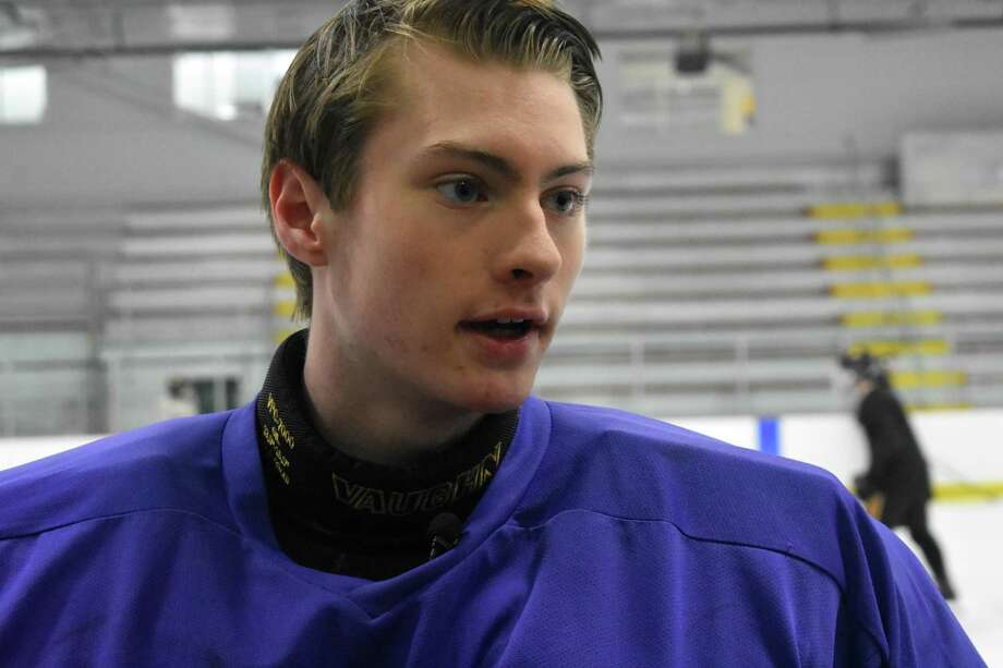 Hand’s Eric Dillner has only been playing goalie for the past three seasons, he also has played his entire hockey career without hearing in his left ear. Photo: Pete Paguaga / Hearst Connecticut Media