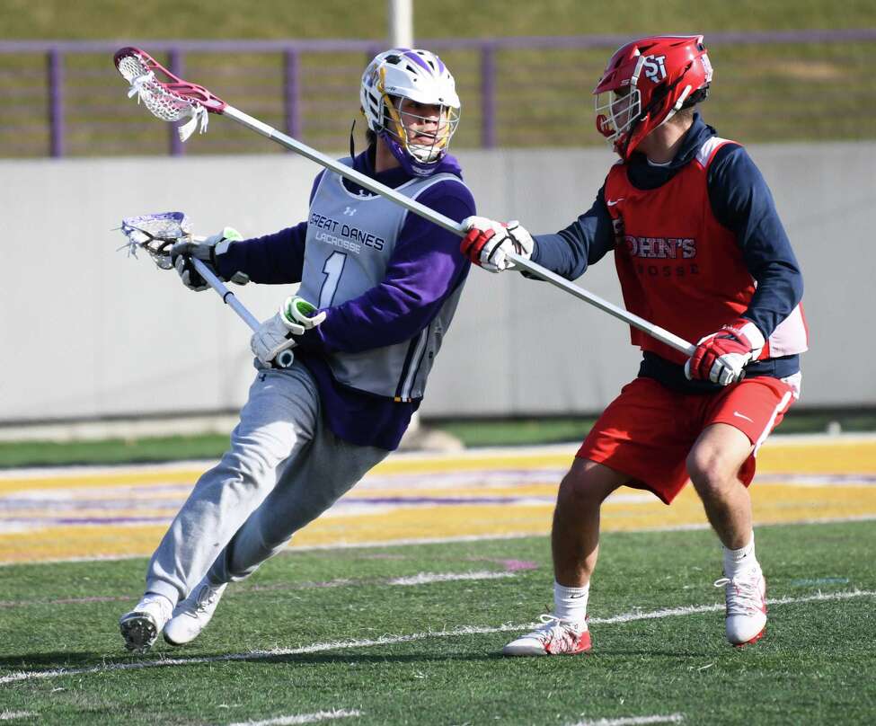 University at Albany's Tehoka Nanticoke, left, is seen during a lacrosse scrimmage with St. John's at Casey Stadium on Thursday, Jan. 30, 2020 in Albany, N.Y. (Lori Van Buren/Times Union)