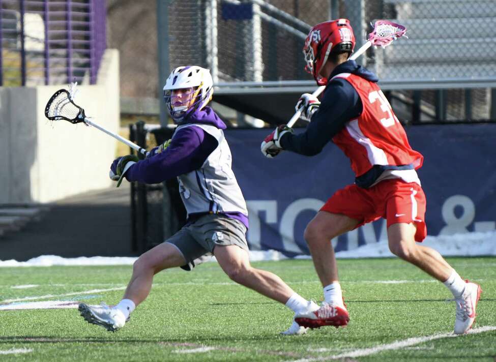 University at Albany's Graydon Hogg, left, seen during a scrimmage lacrosse game with St. John's at Casey Stadium on Thursday, Jan. 30, 2020 in Albany, N.Y. (Lori Van Buren/Times Union)