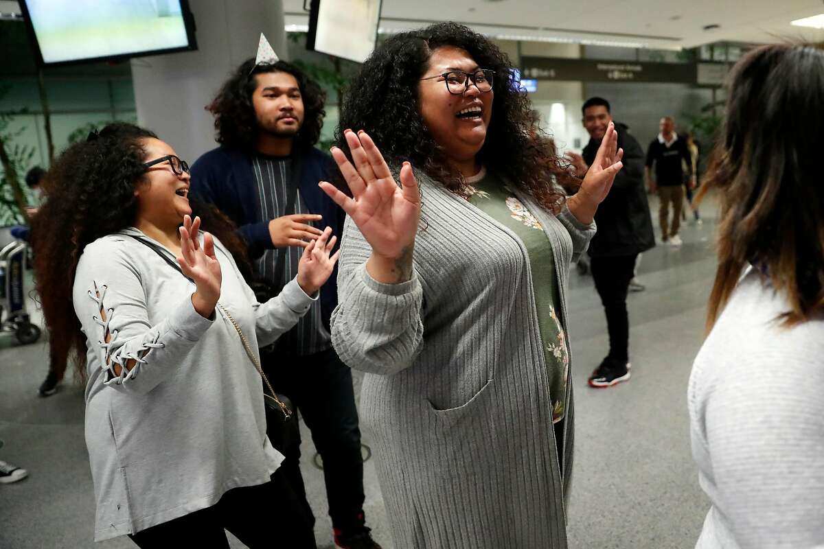 Sokhum Leon dances before being reunited with her brother, Sok Loeun at SFO International Terminal in San Francisco, Calif., on Wednesday, January 29, 2020. Sok Leon was deported to Cambodia 5 years ago.