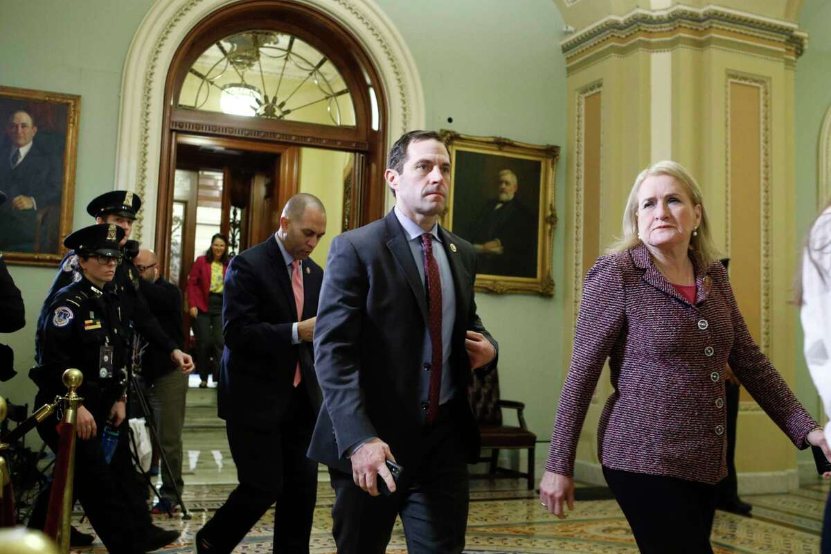 House Democratic impeachment managers, Rep. Sylvia Garcia, D-Texas,, right, Rep. Jason Crow, D-Colo.,, second from right, and Rep. Hakeem Jeffries, D-N.Y., third form right, walk out of the Senate chamber during a break in the impeachment trial of President Donald Trump at the Capitol, Wednesday Jan 29, 2020, in Washington. (AP Photo/Steve Helber)