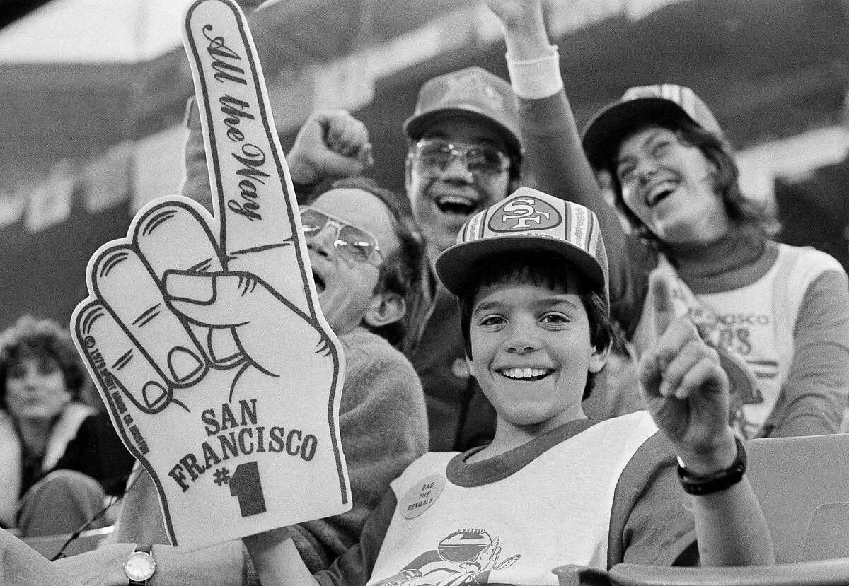 Matt Howard, 11-years-old, of San Francisco, displays a giant number one sign in Pontiac's Silverdome, on Sunday, Jan. 24, 1982, before the start of Super Bowl XVI Between the San Francisco 49ers and the Cincinnati Bengals. (AP Photo)