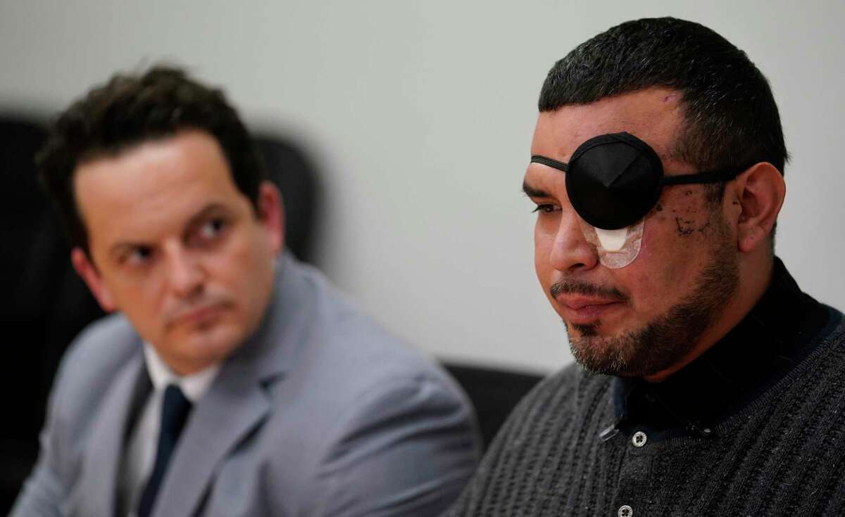 Attorney Joel Simon, left, listens Thursday, Jan. 30, 2020, in Houston as his client, Sean Rangel, an employee at Watson Grinding & Manufacturing, right, talks about the explosion that occurred as he was parking at the company on Friday, Jan. 24, 2020. They have filed lawsuit against Watson Grinding & Manufacturing.